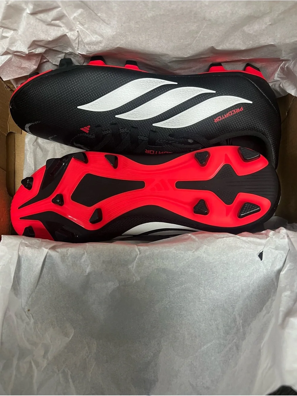 adidas Black Soccer Cleats with White Stripes and Red Accents